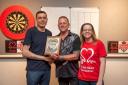 Kevin Edwards (centre) presents the winner's award to Michael Wiles (left) with Emma Meins, event co-organiser
