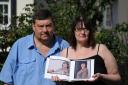 “Heartless” – Gary Homer and Erika Irwin with pictures of their daughter, Jemma Irwin, before she died of cervical cancer last year