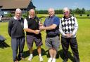 STAR PERFORMERS: front nine winner Alan Brand, overall winner Frank Warbey, Colin Bull, presenting the trophy, and second-placed Jeff Cripps, who was also the back nine winner, following the club’s Memorial Cup.