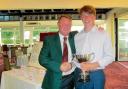 Silverware: Clacton club captain Steve Parks presents Junior club Champion Ben Rendell with his trophy.