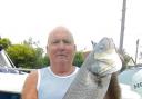 TOP CATCH OF THE WEEK: Dave Hollands used squid bait to catch this cracking 11lbs bass.