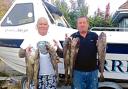 CODLING CATCH: Dave Hollands and Rocky Rochelle.