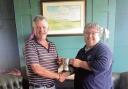 VICTORIOUS: Gavin Cowell receives Frinton Golf Club’s Past Captain’s Trophy from last year’s captain, Luc Gagne.
