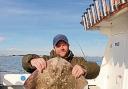 CRACKING RAY: Craig Inwood with his 11lb thornback ray, caught from the charterboat Seawatch.