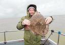 NICE CATCH: Craig McNabb with his thornback ray, caught from the Sophie Lea.