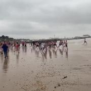John Popplewell caught the Christmas Day swimmers running into the sea on video while walking his dog on the beach