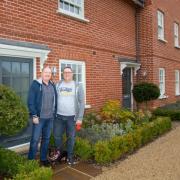 Pleased - Michael and Francois Matysik in front of their new home