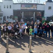 Parents and children of Tendring District Youth Football Club walked from Clacton to Walton pier in aid of Ukraine orphans.