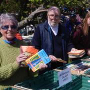 Bookworms - Volunteers Jenny Royce and Tony Barrett with a customer