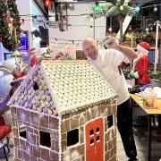 Creation - the gingerbread house and Jon Fraser. Picture: Clacton Pier