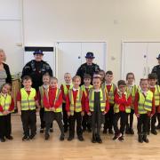 Education - Pupils at the Oakwood Infant and Nursery School, Clacton, were visited by firefighters and police officers to learn about their jobs. Pictured with headteacher Mrs Kathy Maguire-Egan