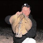 Clacton angler Matt Clarke with his stingray, caught from St Osyth beach.