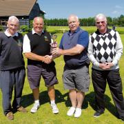 STAR PERFORMERS: front nine winner Alan Brand, overall winner Frank Warbey, Colin Bull, presenting the trophy, and second-placed Jeff Cripps, who was also the back nine winner, following the club’s Memorial Cup.