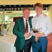Silverware: Clacton club captain Steve Parks presents Junior club Champion Ben Rendell with his trophy.