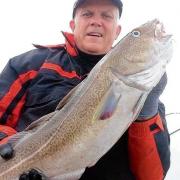 NICE CATCH: Mike Gray with his 16lb 4oz cod, caught two miles off Holland-on-Sea.