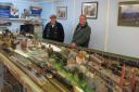 Creative - Club member Ken Bennett with chairman Richard Puzey overseeing a OO layout