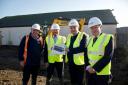 House building - Paul Honeywood (second from right) pictured during work to build new council homes in Jaywick