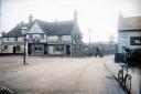 'The Ship Inn' in 1910. Great Clacton Windmill is in the distance and a lamppost in the middle of the road