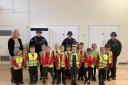 Education - Pupils at the Oakwood Infant and Nursery School, Clacton, were visited by firefighters and police officers to learn about their jobs. Pictured with headteacher Mrs Kathy Maguire-Egan
