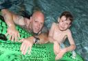 Father and son having fun in the Clacton leisure centre pool