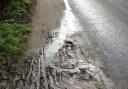 Dangerous - A view of an unkempt muddy pavement between Kirby and Walton