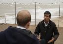 Visit - Rishi Sunak speaking to a reporter in Clacton