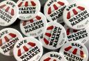 Pride - The 'Save Walton' badges available in town