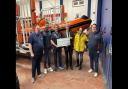 Donation - RNLI team members receiving the cheque from the Clacton Round Table
