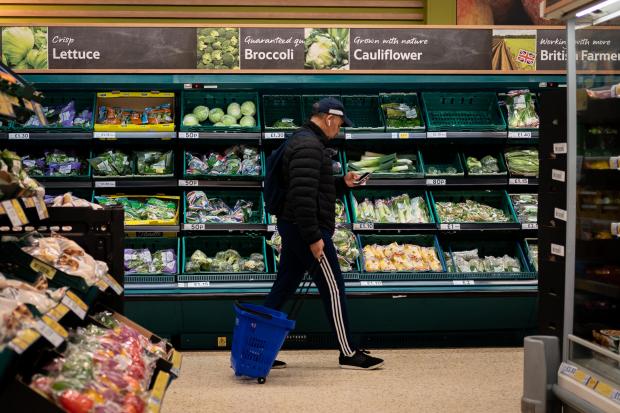 Clacton and Frinton Gazette: A shopper walks through the salad aisle in a branch of Tesco (PA)