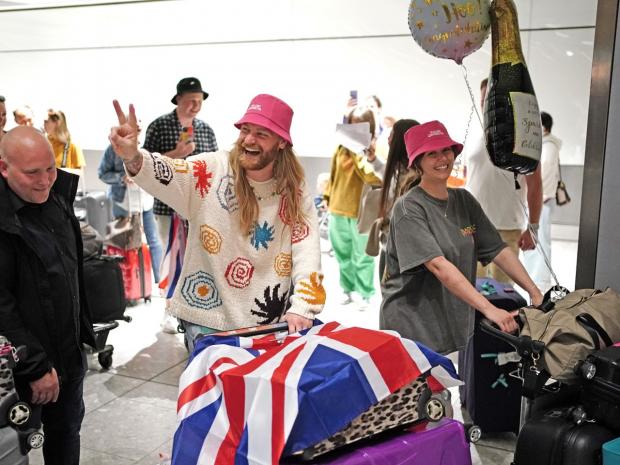 Clacton and Frinton Gazette: Sam greeted fans at London Heathrow yesterday evening. Credit: Dominic Lipinski/PA Wire 