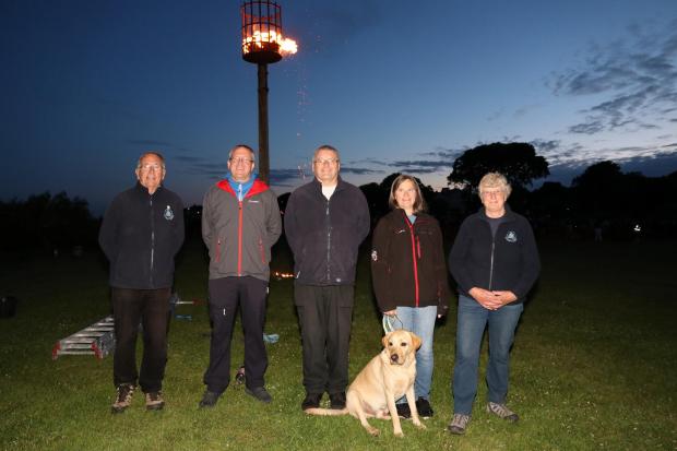 Clacton and Frinton Gazette: Colin Farnell, Geoff Pearson, Alan Baxter, Hugo, Val Baxter and Aileen Farnell - Lighting of the Harwich Jubilee Beacon, Cliff Park Picture: Maria Fowler 2022