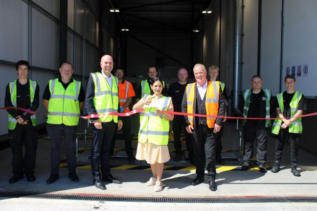 Open - Priti alongside General Manager for North Essex, Scott Fogharty (left) and Managing Director, Lee Seward cuts the ribbon to open the new HGV MOT facility at Motus Truck &Van. (Stuart Gulleford)