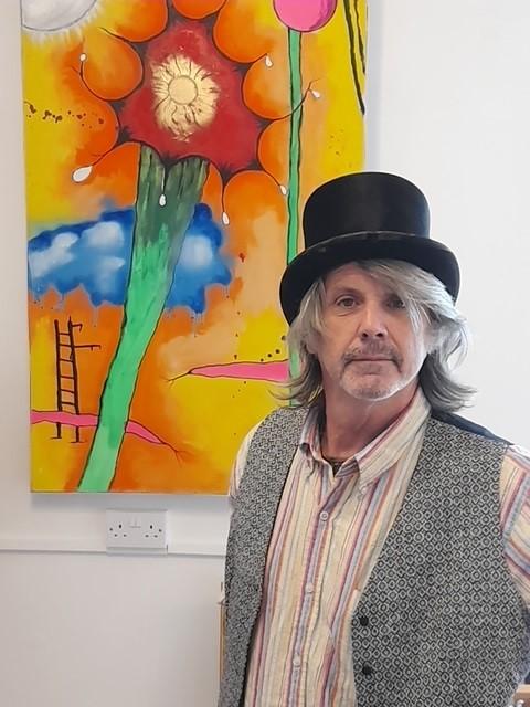 Clacton and Frinton Gazette: Bright - Michael Sparrow pictured with some of the work on display at his exhibition Clacton and Frinton Gazette: Bright - Michael Sparrow pictured with some of the work on display at his exhibition