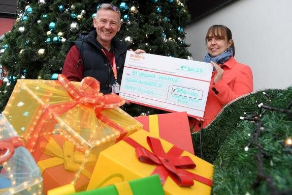 Clacton and Frinton Gazette: Presents - The cheque with the village's festive decorations Clacton and Frinton Gazette: Presents - The cheque with the village's festive decorations