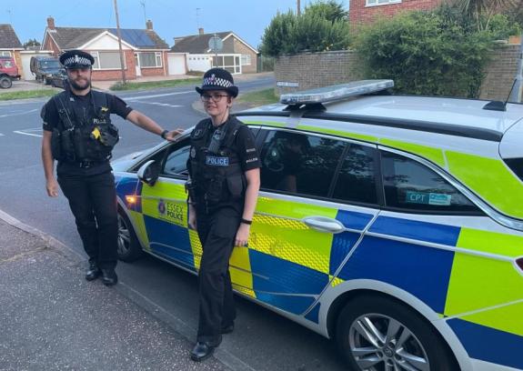 Clacton and Frinton Gazette: Protect - Police officers by a police car Clacton and Frinton Gazette: Protect - Police officers by a police car