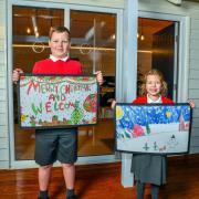 Winners - Harley, 10, and Annalie, 7, with their winning designs at St Osyth priory