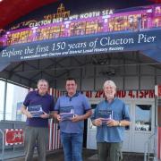 Book launch - Norman Jacobs (left) and Billy Ball (centre) outside the Jolly Roger on Clacton Pier