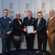 Gold Award - Anastasia Simpson and Chris Amos collecting the award from officials at the presentation evening. Picture: Ministry of Defence