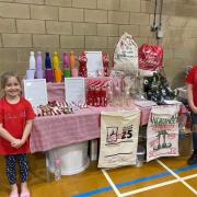 All Smiles - Summer and Ella selling their wares.