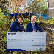 Donation - Emma Sweeney, Peter Schwier, Essex County Council climate czar, and pupils from Great Clacton C of E Junior School in the disused pond area.