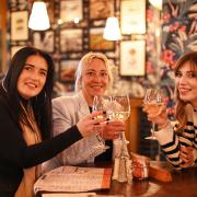 Cheers - three of Martello Lounge's first visitors raise a glass