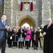 Unveiling - William Grinsted, from the St Osyth estate team with guests and Paul Wilson, master craftsman of the restoration of the Coat of Arms