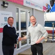 Matthew Young pictured with David Morris, of David Morris Yacht Brokers, at the new office at Titchmarsh Marina, Walton