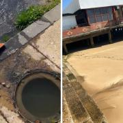 The sewage leak is coming out of a drain and is falling onto the beach