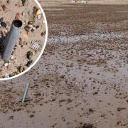 Dangerous metal poles found sticking out of beach removed after residents' concerns