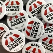 Pride - The 'Save Walton' badges available in town