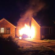Ablaze - a van on fire outside Mr Watson's neighbour's home