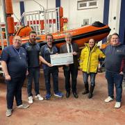 Donation - RNLI team members receiving the cheque from the Clacton Round Table